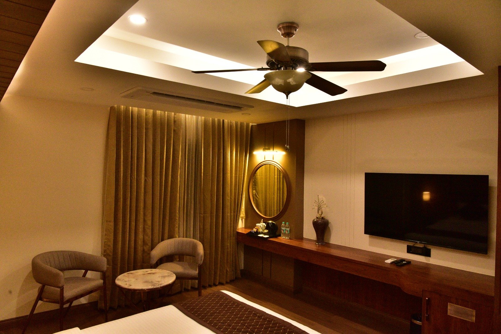Comfortable bed and soft lighting in Guwahati hotel room